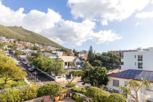 an aerial view of a city with a mountain at Comfy Central with Balcony and Views in Cape Town