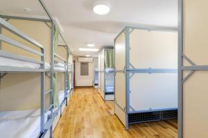 a row of bunk beds in a dorm room at Galway City Hostel in Galway +32 photos