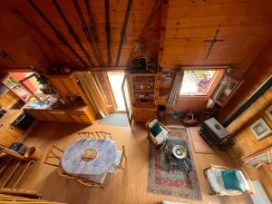 an overhead view of a living room with a table at Mountain Chalet in Beauvezer in Beauvezer