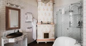 a bathroom with a sink and a toilet and a tub at Hotel Kung Carl, WorldHotels Crafted in Stockholm +132 photos