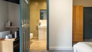 a bathroom with a sink and a toilet in a room at The Granby Hotel in Whitby