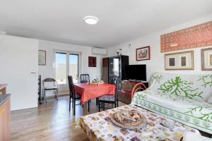 a living room with a couch and a table at La Mansarda - Terrazze Relax A Due in Cellamare