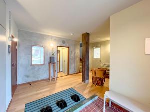 a living room with a rug on the floor at BRICKS and BLOCKS MIYOTA in Miyota