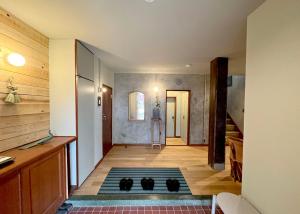 a room with a kitchen and a hallway at BRICKS and BLOCKS MIYOTA in Miyota