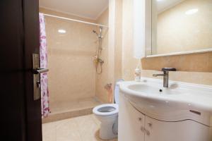 a bathroom with a sink and a toilet and a shower at Dor de Mare - Piata Ovidiu Constanta in Constanţa +12 photos