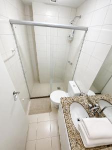 a bathroom with a sink and a toilet at Charmoso apartamento na Lapa in Rio de Janeiro