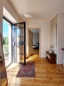 an open living room with a sliding glass door at Selo Station in Črniče