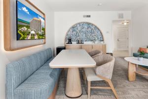 a living room with a couch and a table at Naples Grande Beach Resort in Naples