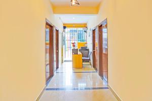 a corridor of a room with a hallway at Hotel O JK Blue Rock Comforts in Bangalore