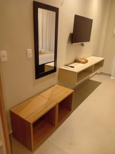 a bathroom with a sink and a mirror at AMARE Condomínio ap 103 in Barra Grande