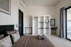 a living room with a couch and a table at Tris Villas ocean view in Kuta Lombok