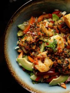 a bowl of food with shrimp and vegetables at Hotel Grodzki Business & Spa in Stargard