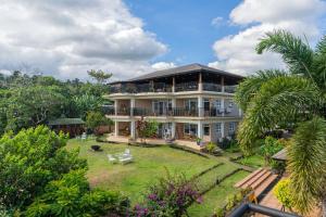 an image of a house with a garden at Tanawin BnB in Orani