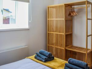 a room with a bed and a book shelf at Erddyn - Uk48860 in Llanddwywe