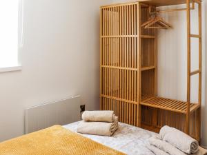 a bedroom with a bed and a book shelf at Bodlyn - Uk48861 in Llanddwywe +13 photos