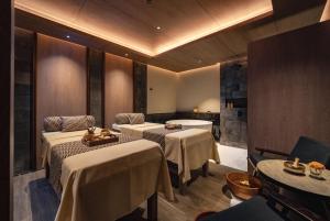 a restaurant with three tables and a room with a table at Nuju Uluwatu - Adults Only in Uluwatu +38 photos
