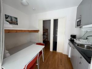 a small kitchen with a counter and a sink at STF Visby Hamn Vandrarhem in Visby