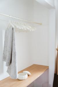 a shelf in a room with towels on it at Ocean Breeze Inn in Eyemouth +72 photos