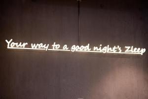 a sign that says your way to a good nightsayer at Zleep Hotel Lausanne-Chavannes in Lausanne