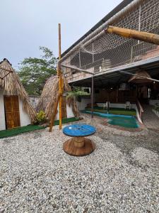 a house with a blue table in front of it at Mar y Montana in Taganga