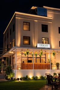 a white building with a sign on it at night at Udaigarh Palace - The Heritage Hotel in Jodhpur