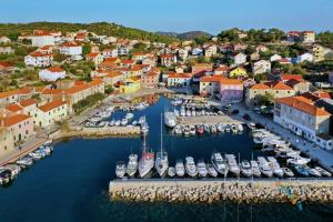 an aerial view of a harbor with boats at Rooms LuaMar in Sali +2 photos