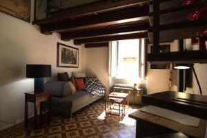 a living room with a couch and a piano at lovely vintage apartment climatizzato inalpi in Turin