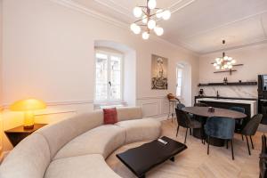 a living room with a couch and a table at Villa Ofellia in Dubrovnik