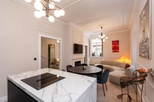a living room with a couch and a table at Villa Ofellia in Dubrovnik