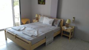 a bedroom with a large bed with pillows on it at Oasis studios in Psili Ammos +46 photos