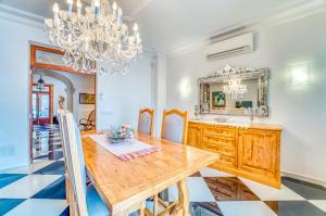 a dining room with a table and a mirror at Ideal Property Mallorca - Can Peret in Sa Pobla
