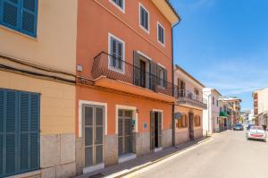 a row of buildings on a city street at Ideal Property Mallorca - Can Peret in Sa Pobla