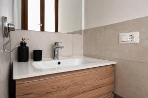 a bathroom with a sink and a mirror at Dimora Febo in Centro Storico in Piombino +16 photos