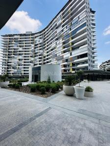 a large apartment building with a large building at Green Ville Residence in Baku