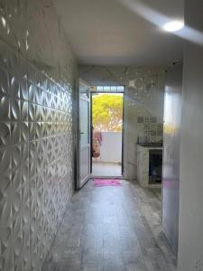 a hallway of a bathroom with a shower and a window at Nesma Douaouda in Douaouda +21 photos