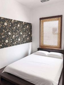 a bedroom with a white bed and a window at Sunny House Seaside in Zatoka +16 photos