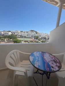 a table and chairs in a room with a view at Summer Time in Ios Chora +18 photos