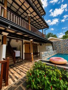 a porch of a house with a swimming pool at AZORA Boutique Studios in Ahangama