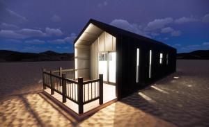 a rendering of a small building in the desert at Roam America Horseshoe Bend in Page +37 photos