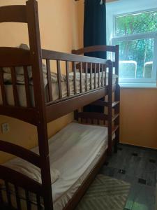 two bunk beds in a room with a window at Good driams Xoctel in Kyiv