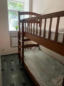 a bedroom with two bunk beds and a window at Good driams Xoctel in Kyiv