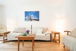 a living room with a couch and a table at Appartment am Mondsee in Mondsee