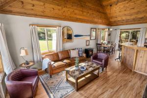 a living room with a couch and a table at Glacier River Ranch - Flathead in Columbia Falls