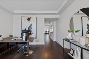 an office with a desk and a chair in a room at The Oakville House in Oakville +6 photos