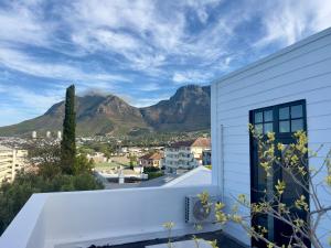 a view of the mountains from the balcony of a house at Nomad City Suites in Cape Town +5 photos