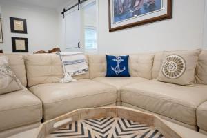 a living room with a couch with a coffee table at Battery Place in Savannah +18 photos