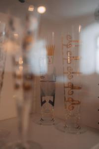 three glass vases sitting on a shelf in a store at Historische, moderne Stadtwohnung in Riedlingen +47 photos