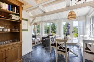 a kitchen and living room with a table and chairs at Gästehaus Altes Forstamt Sinntal in Sinntal +32 photos