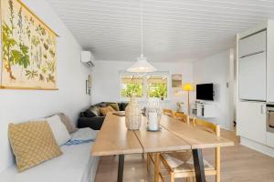 a living room with a table and a couch at SB134-Sydals-Osterbyvej-54-B in Østerby