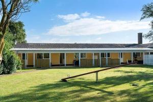 a yellow house with a large yard in front of it at SB134-Sydals-Osterbyvej-54-B in Østerby +16 photos